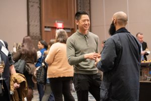 Chris Lau speaks with guests.