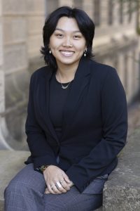 Photo of Melina Nguyen, a young woman with brown skin, black hair, and dark eyes.