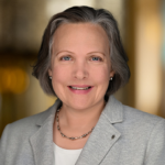 Photo of a woman with gray hair.