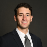 Photo of a young man with dark hair.