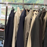 Photo of clothes on a rack.