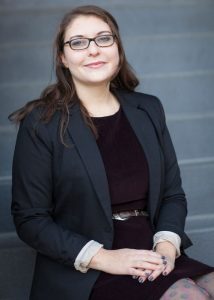 Young woman in dark business attire.