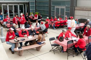alumni eating at tables outside of the law school