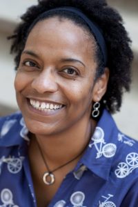 Photo of black woman smiling.