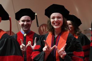students signing a W for Wisconsin at UW Law school graduation, May 2019