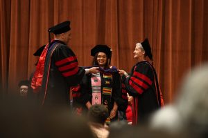 student being hooded at UW Law graduation, May 2019