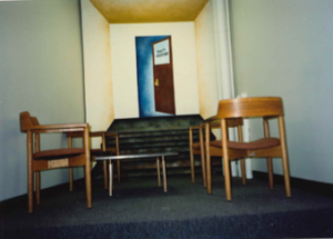 chairs and desks in a small hallway