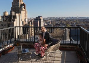 working on balcony with kid