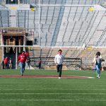 3Ls running across camp randall in an empty stadium from spring 2021