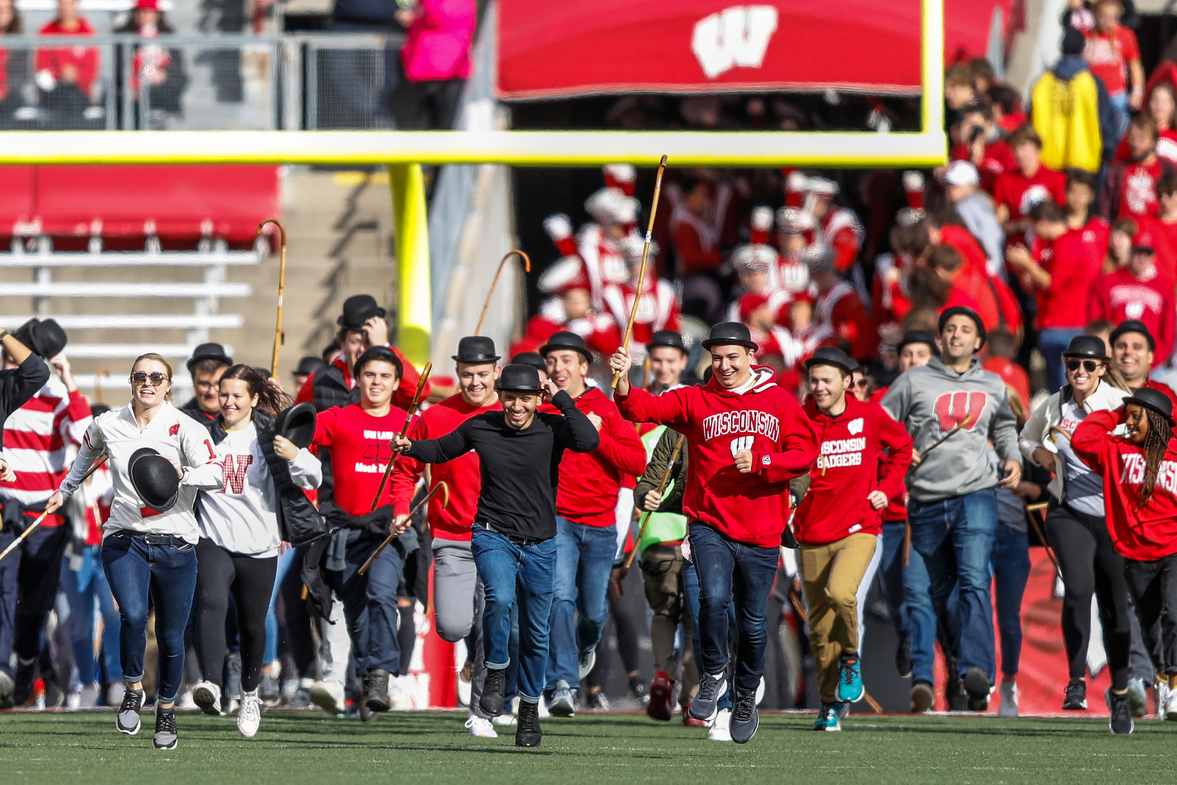 3Ls running across camp randall in an stadium from fall 2021