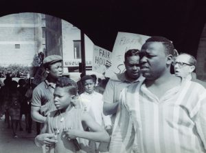 black men at a fair housing protest