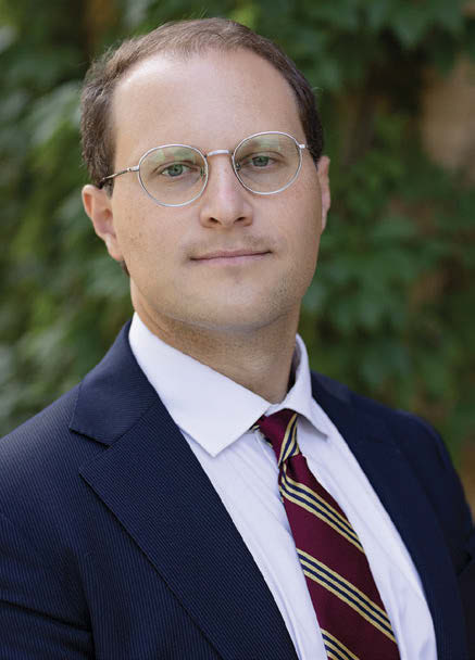 Photo of Adam Sopko looking into the camera.