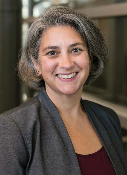 A headshot of Bree Grossi Wilde smiling at the camera.
