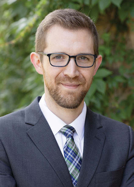 Photo of Derek Clinger smiling at the camera.