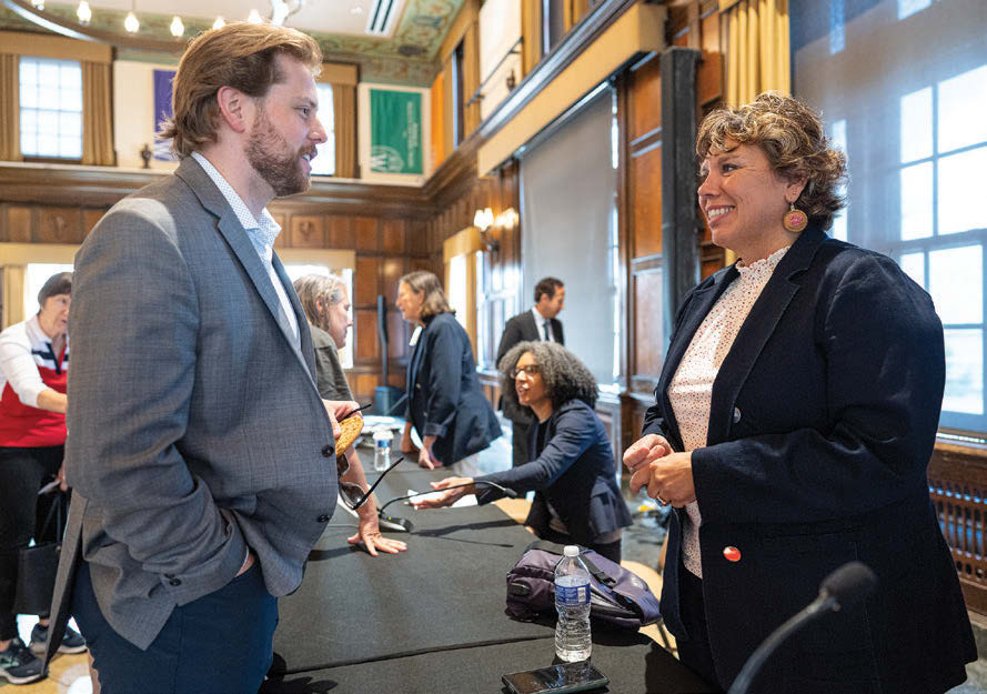 A man in a gray suit speaks to a woman in a dark blue blazer. Associate Professor Robert Yablon leads a panel discussion with state supreme court justices for State Democracy Research Initiative’s “Public Law in the States: The Work of State Supreme Courts” event June 2, 2023, at Memorial Union on the UW–Madison campus.