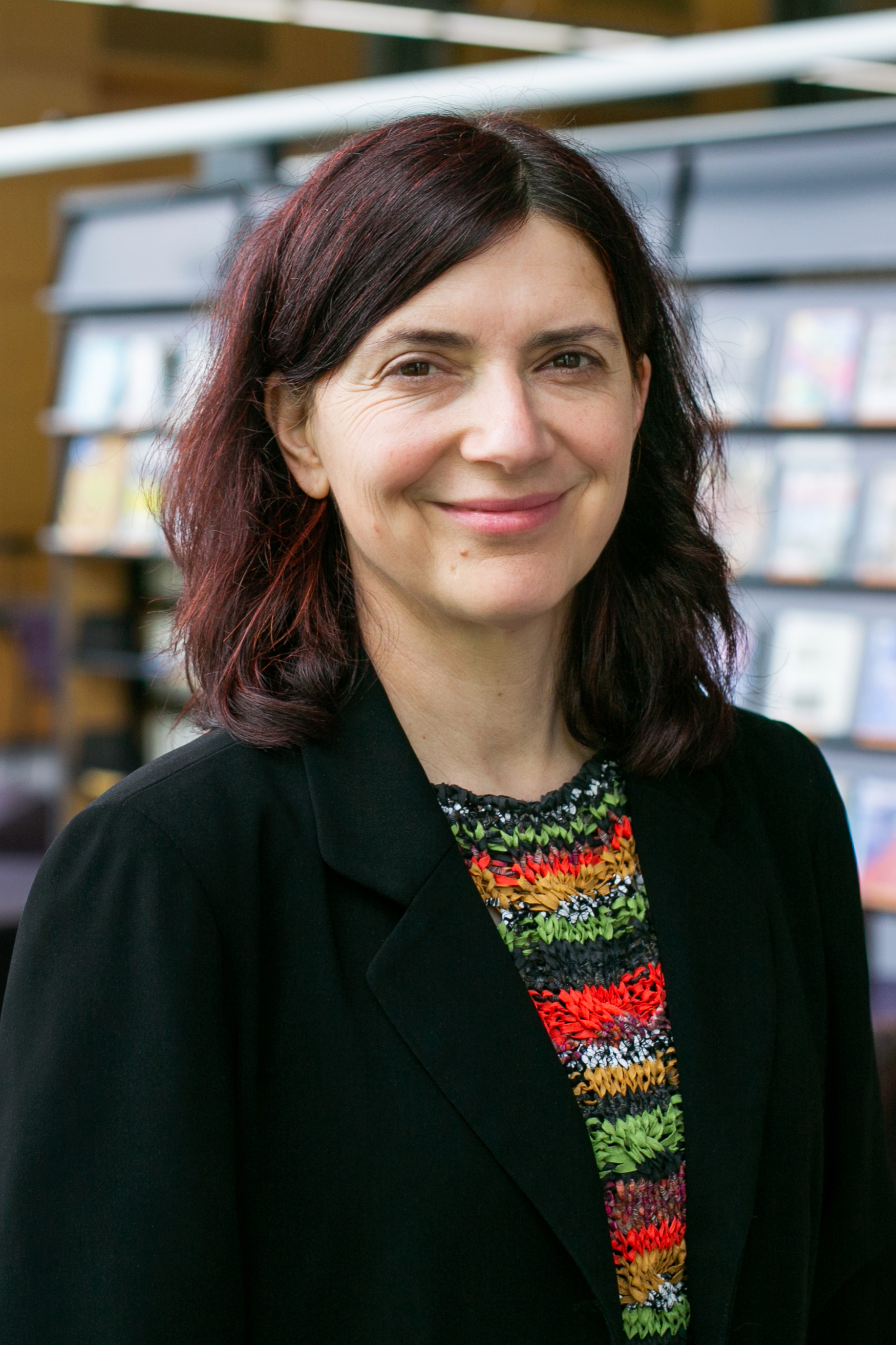 A headshot photo of Alexandra Huneeus