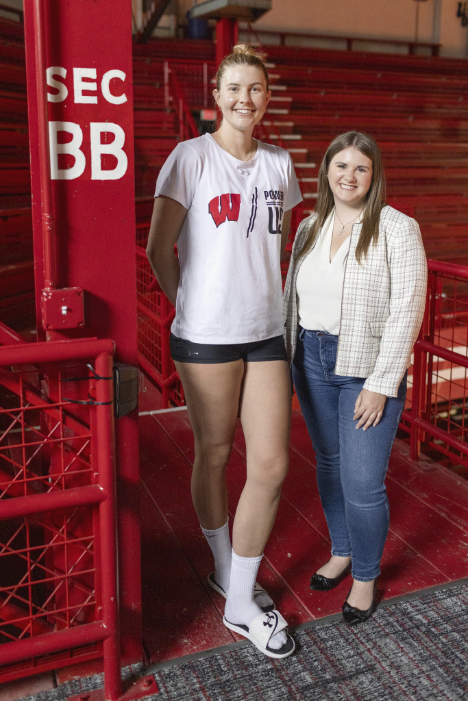 Sarah Franklin is pictured here standing beside Nicole Reed near the bleachers in a gymnasium.