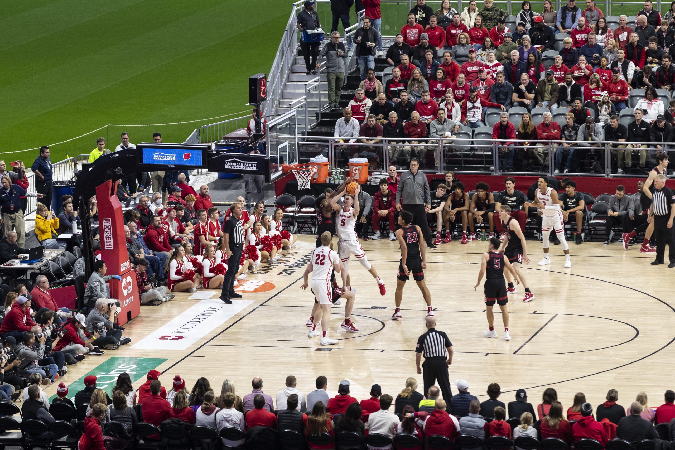 Wisconsin’s Tyler Wahl (5) shoots as the Wisconsin Badgers play the Stanford Cardinals during a men’s basketball game held on a temporary court installed in the infield of American Family Field in Milwaukee, Wis., on Veterans Day Nov. 11, 2022. The Badgers won the game, 60-50. The doubleheader event, known as Brew City Battle, is the first time that American Family Field, home of the Milwaukee Brewers, has been transformed from baseball diamond into a unique basketball venue inside the stadium. (Photo by Taylor Wolfram / UW–Madison)