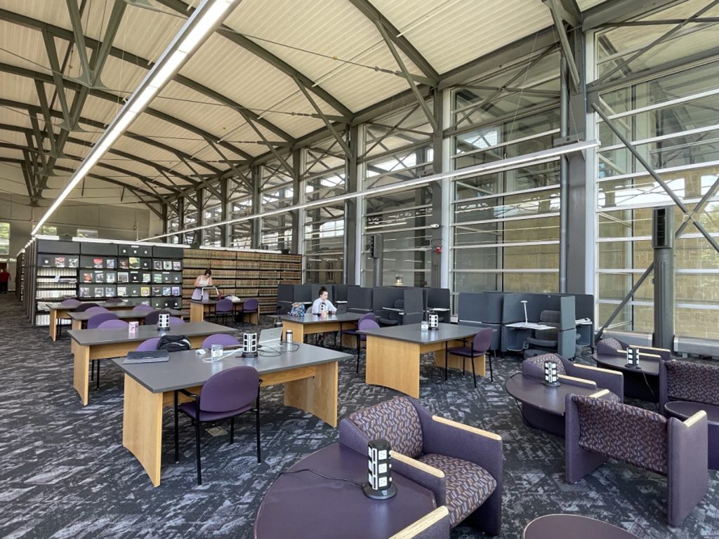 Photo of the Law Library interior, featuring long rows of windows and arched canopy for natural light.