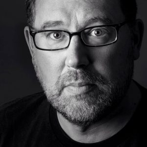 Headshot photo of David John Ceci.