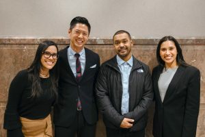 Manuel Cucuta standing with Chris Lau, Gabriella Marquez, and Noemi Reyes.