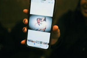 Image of mobile phone showing a photo of Manuel Cucuta and his girlfriend sitting together years ago.
