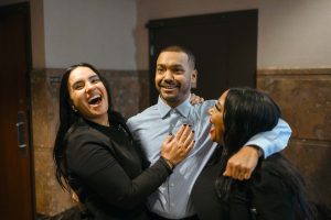 Manuel Cucuta with loved ones laughing.