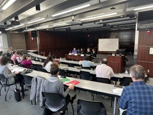Midwest Clinical Conference participants listen to a panel of speakers.