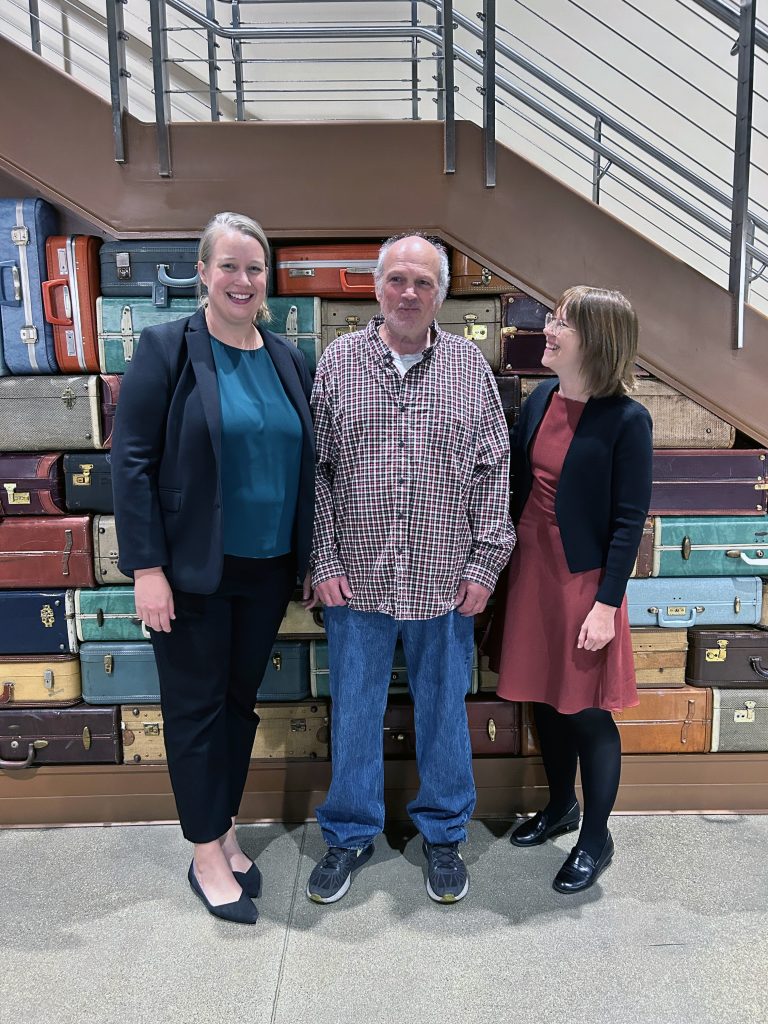 Rachel Burg, David Bintz and Zoe Engberg stand together in a photo.