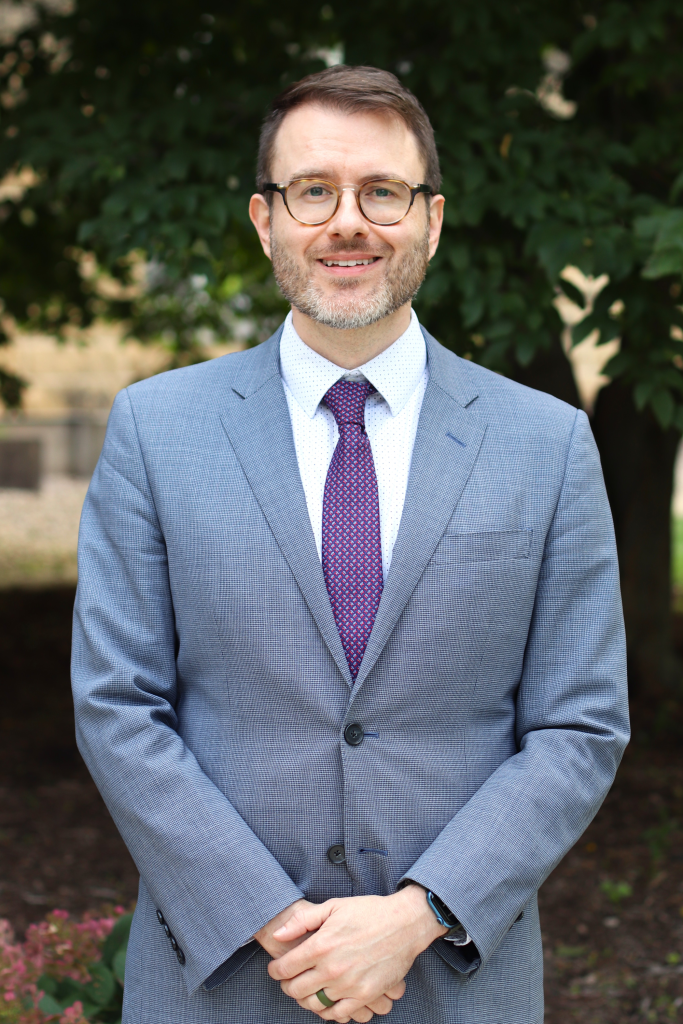 Photo of BJ Ard, a middle-aged man with light skin, brown hair, glasses, and a light, graying beard.