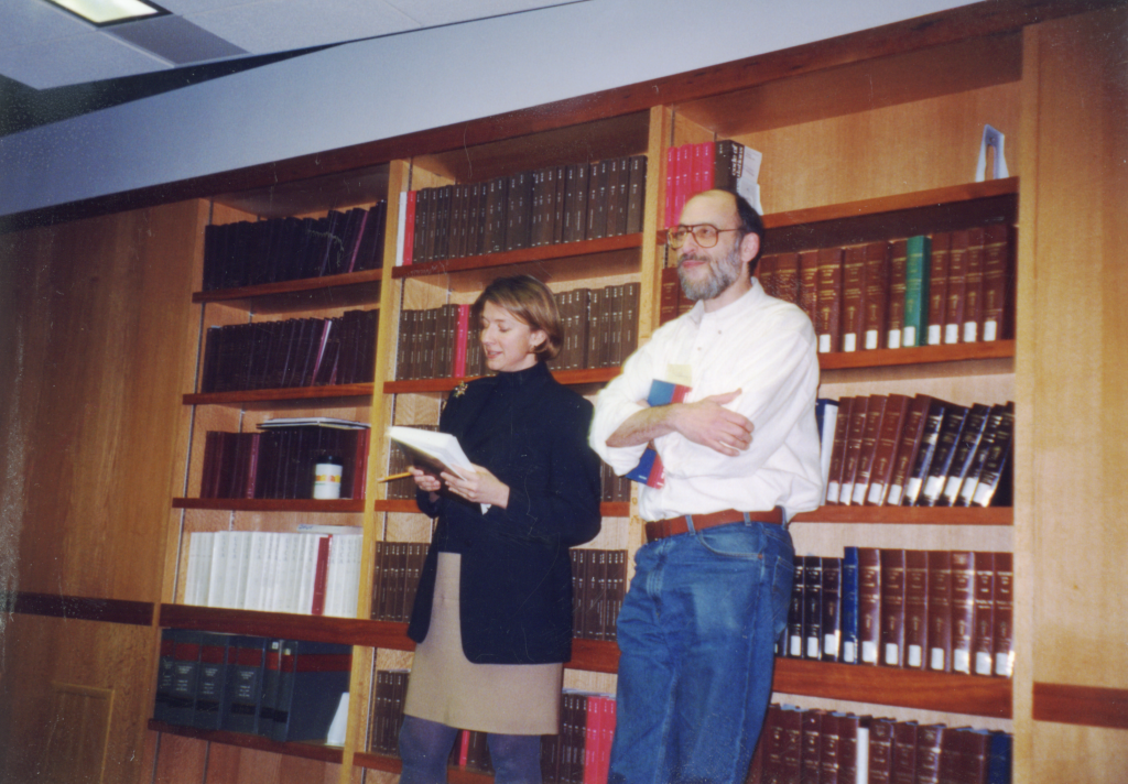 male and female professors stand side by side in an old photo