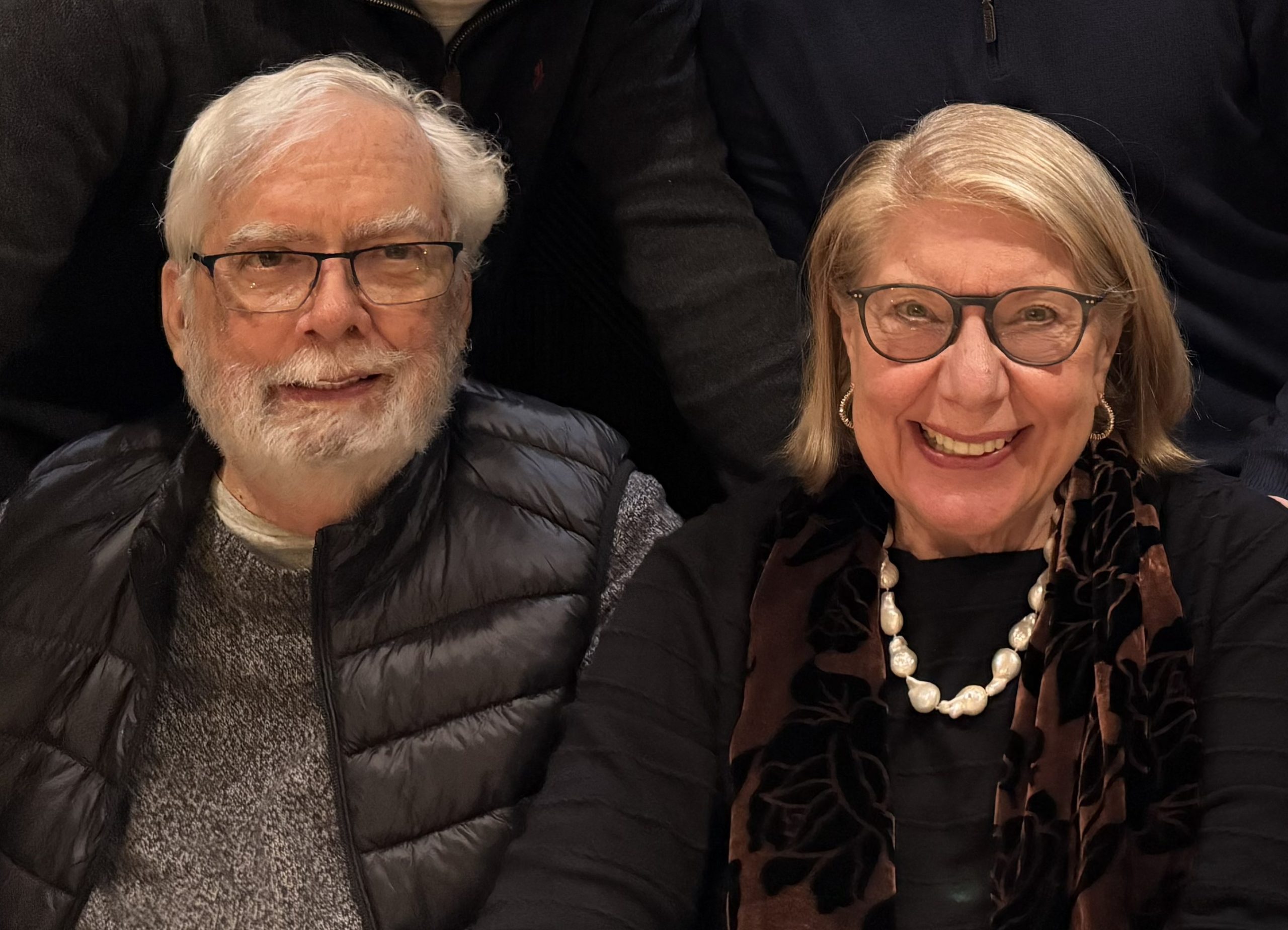 Photo of two senior folks - A man with a scruffy white beard and a woman with cropped blonde hair.